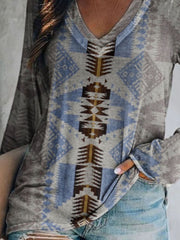 Geometric print long sleeve v-neck t-shirt in grey with blue and brown pattern.
