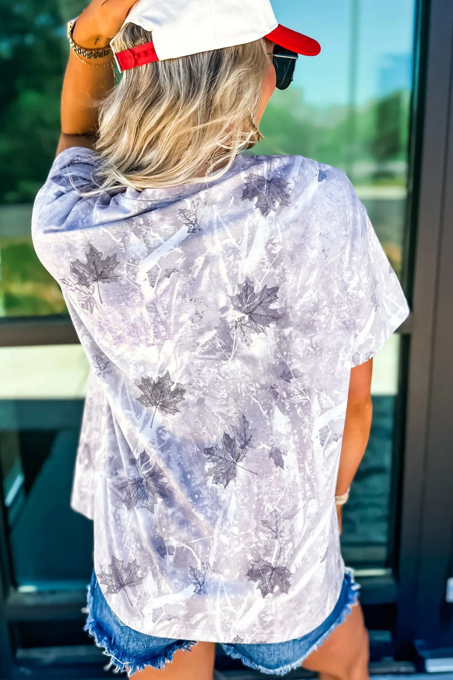 Faded camouflage tunic tee with leaf print, crew neck, and short sleeves.