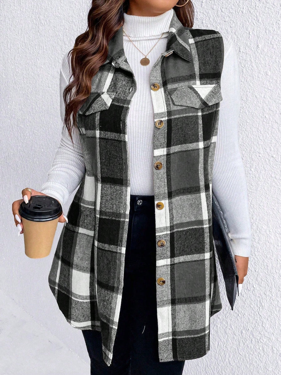 Oversized plaid shirt vest in black and white with button front and chest pockets.