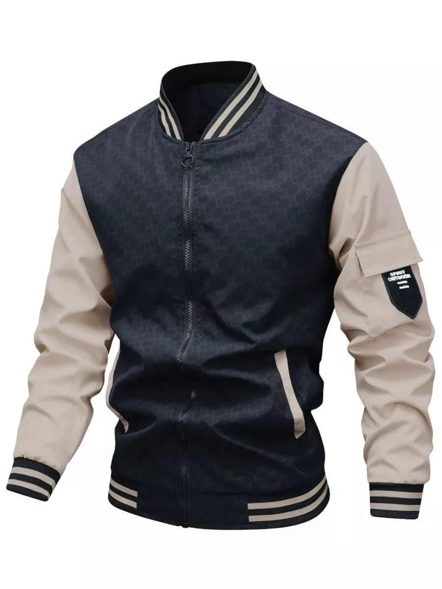 Contemporary bomber jacket in black with tan sleeves, striped collar and cuffs, and pocket details.