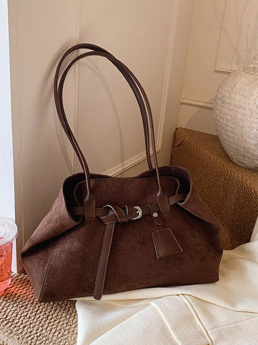 Brown suede shoulder bag with buckle detail and top handles
