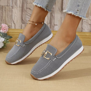 Chic mesh slip-on loafers in gray with gold buckle detail.