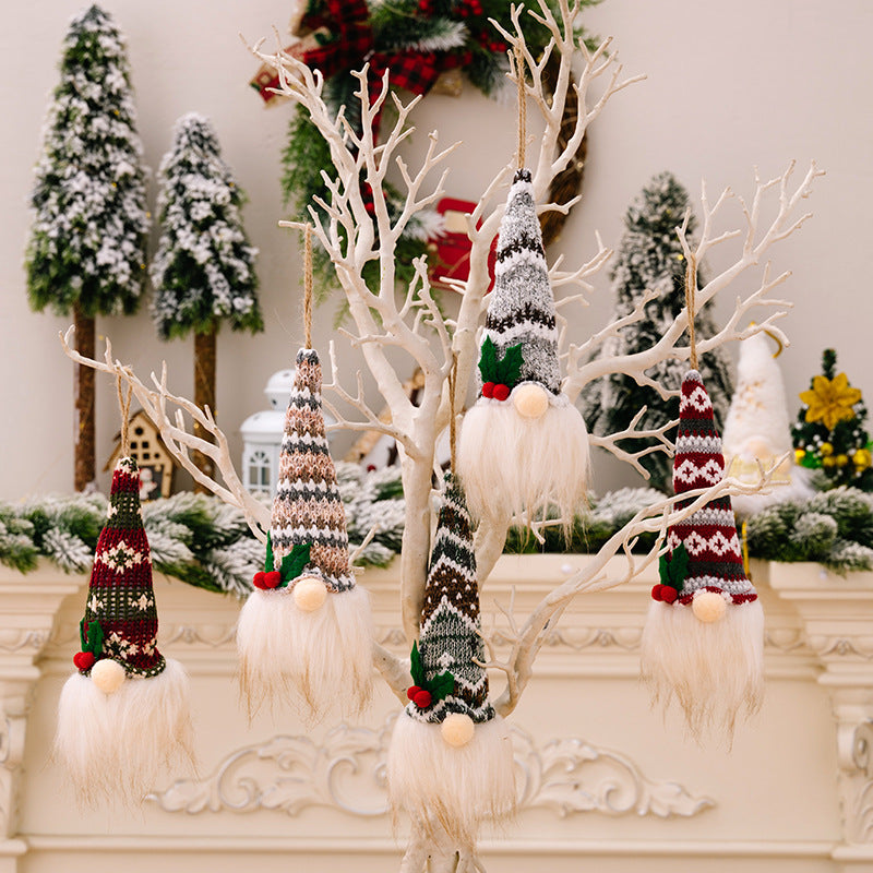 Illuminated gnome ornaments with knitted hats in various patterns and colors, featuring white beards.