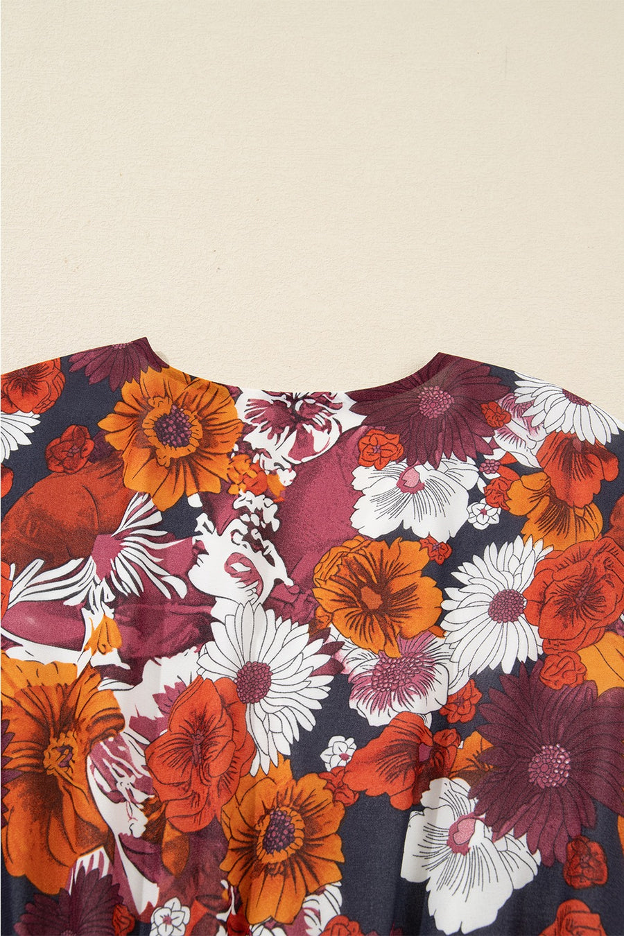 Floral wrap mini dress with puff sleeves in autumnal floral print.