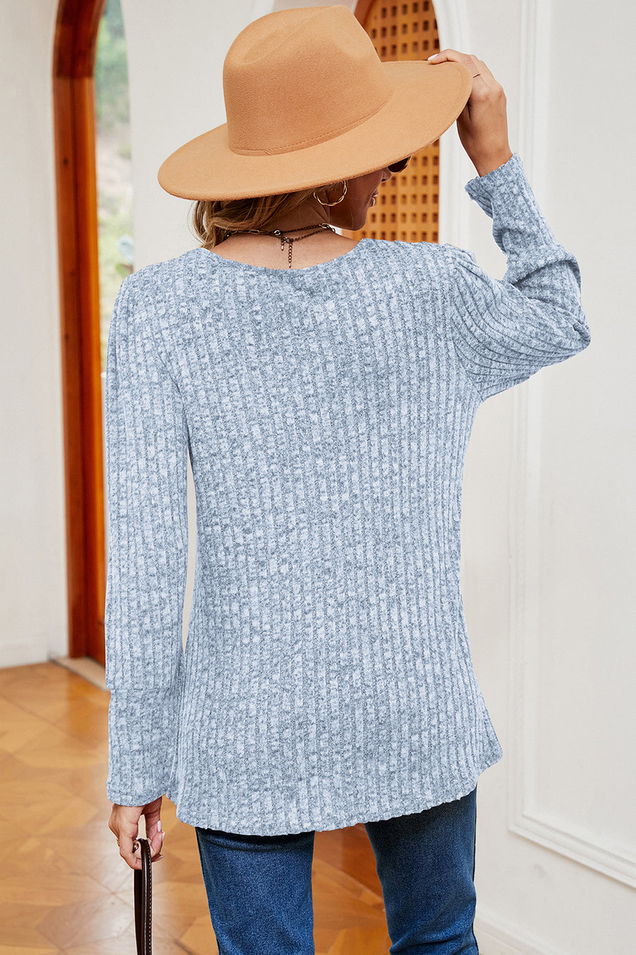 Light blue ribbed button-down top with long sleeves and asymmetric hem