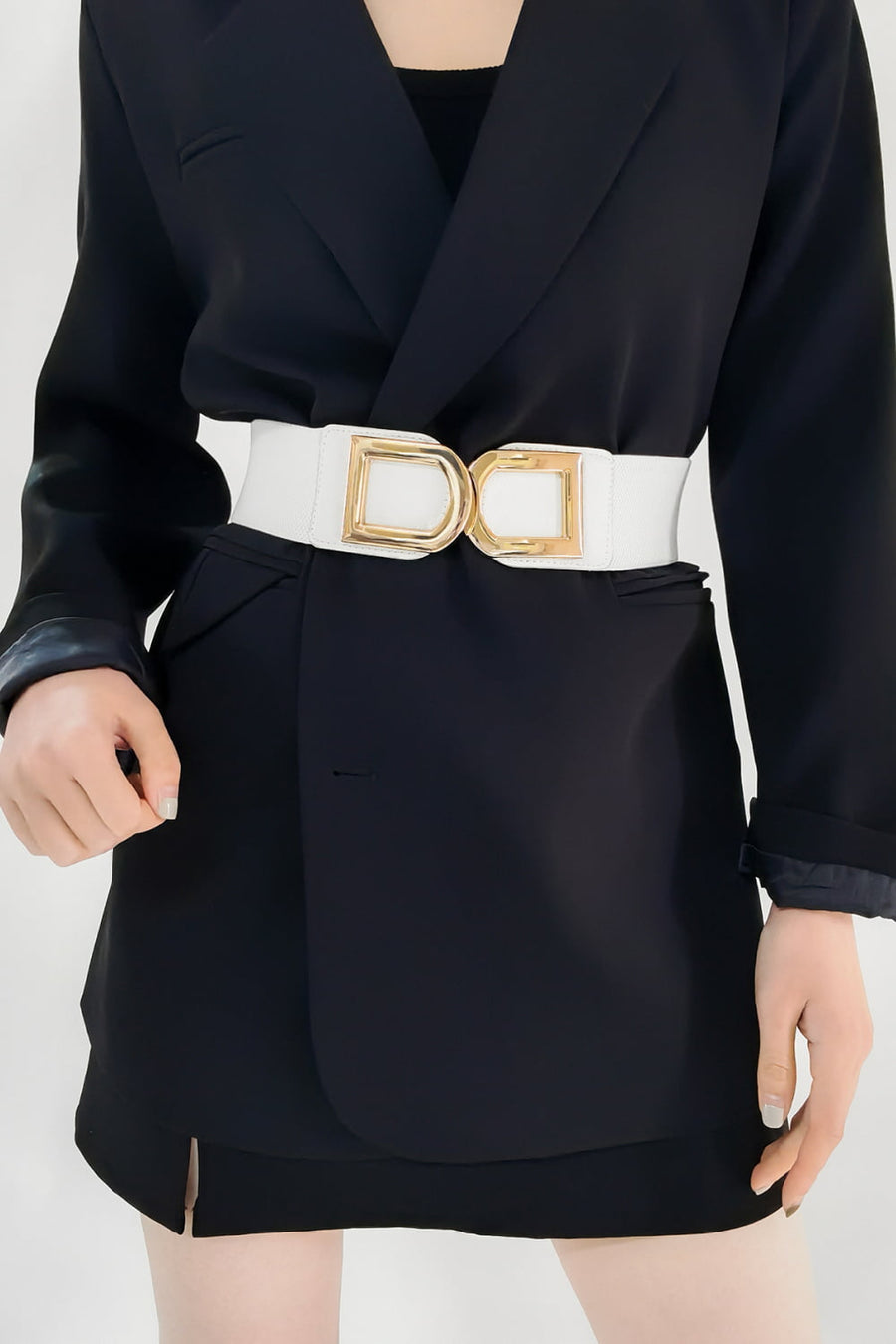 White elastic belt with double gold D-ring buckle detail