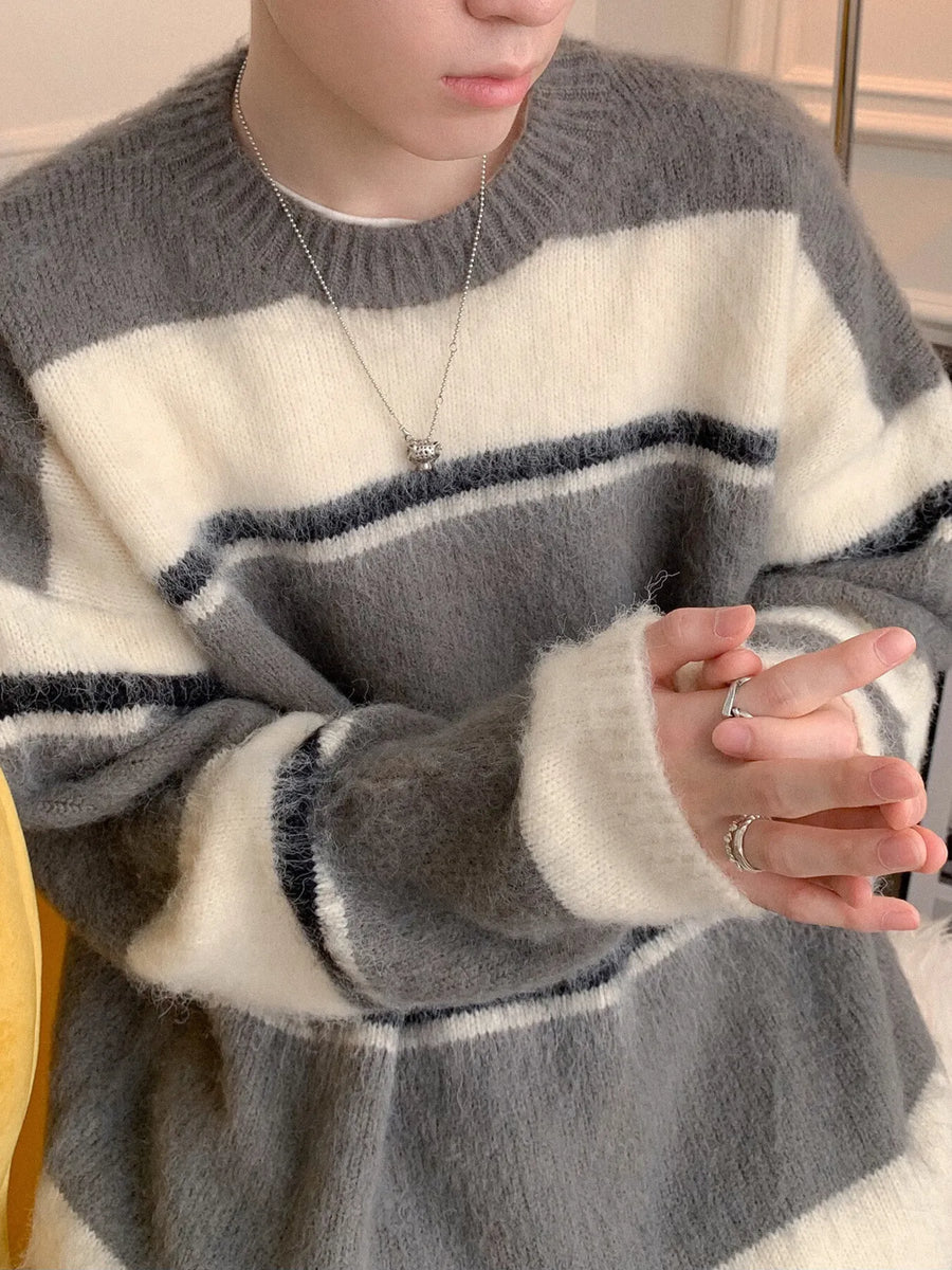 Grey and white striped fuzzy knit pullover sweater with crew neck.