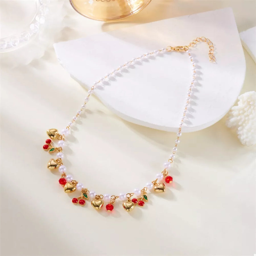 necklace in gold with motif and pearl embellishment