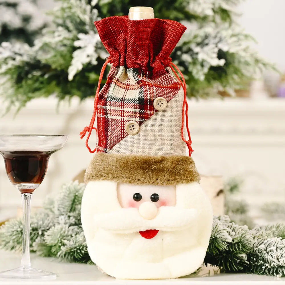 Holiday wine bottle cover with Santa face and plaid fabric top.