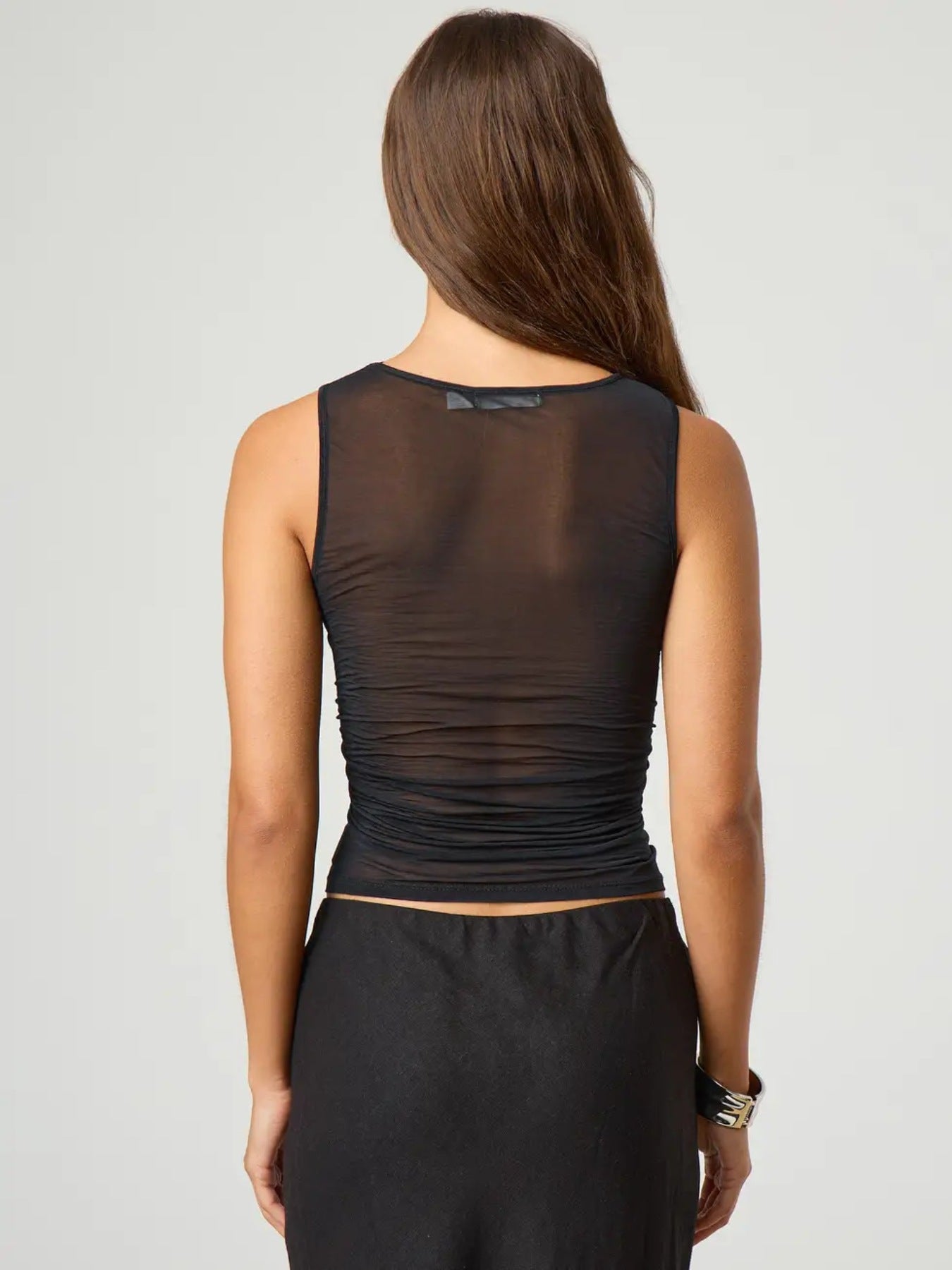 Black sheer ruched tank top with a square neckline and sleeveless cut.