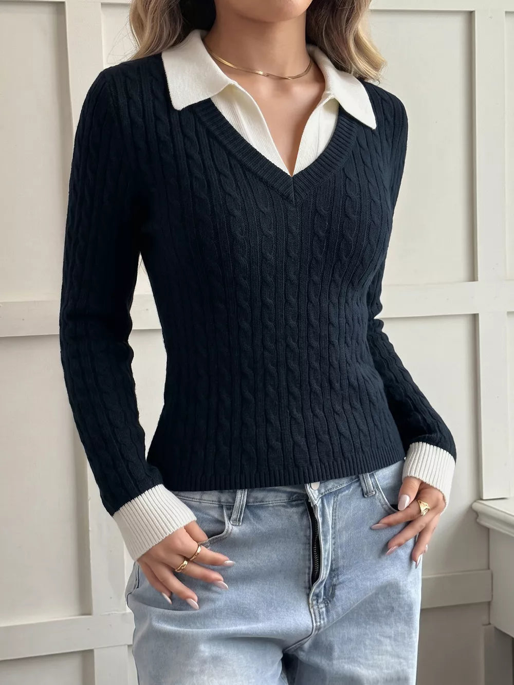100% polyester Care instructions: Machine wash cold pullover sweater in navy blue with fitted silhouette