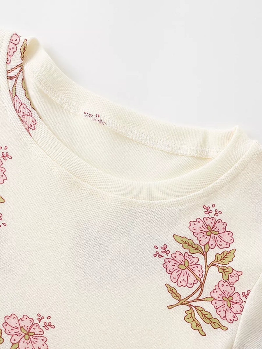 Charming floral cotton dress for toddlers in beige, featuring pink floral print and crew neck.