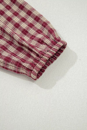 Country plaid long sleeve blouse in burgundy with elastic cuff detail.