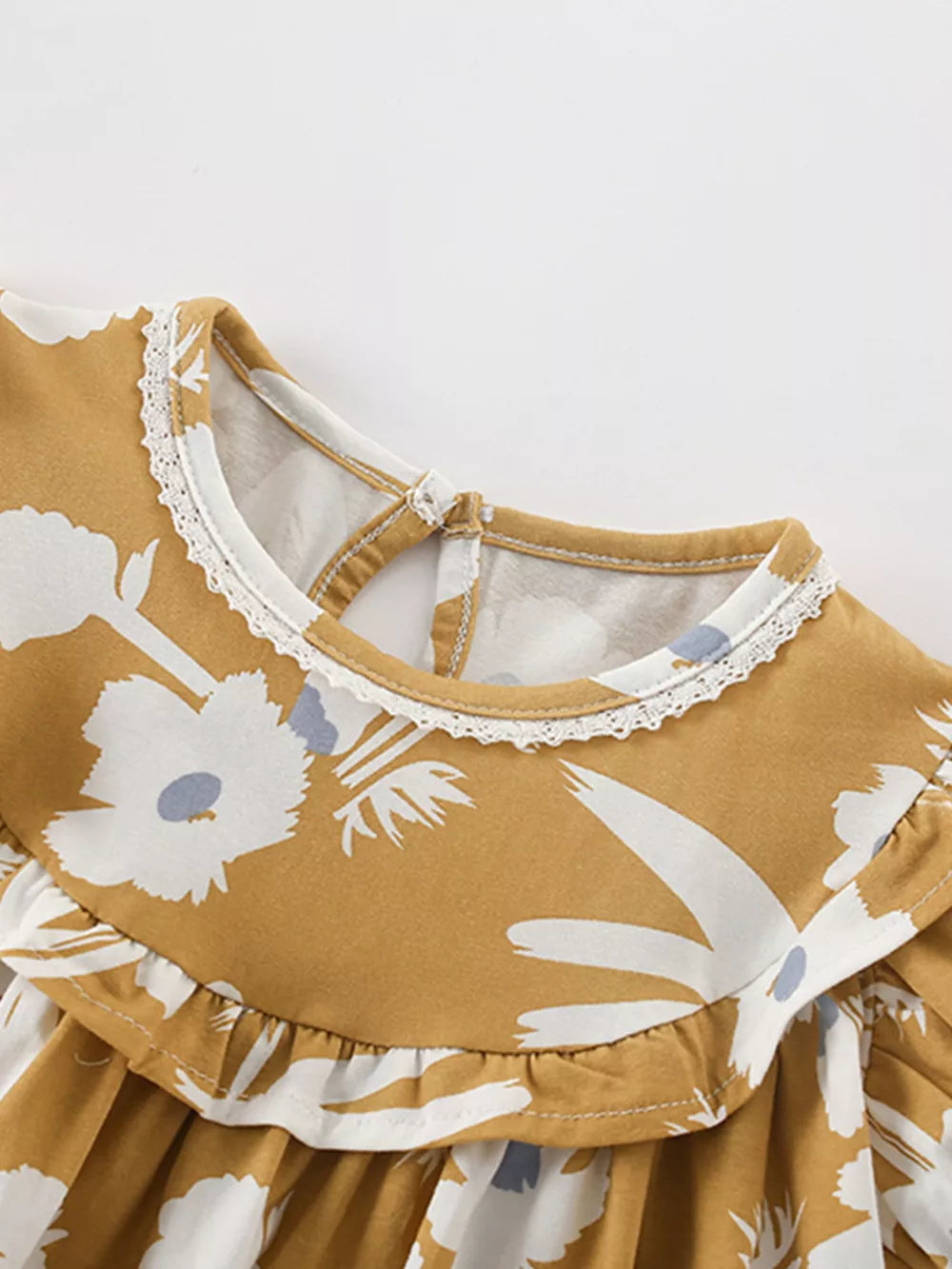 Toddler dress with floral print, ruffle collar, and lace trim.