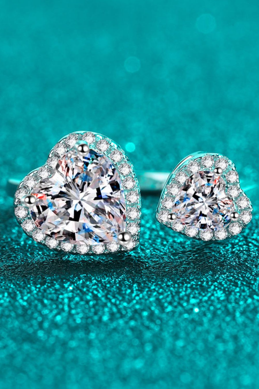 Double heart halo ring in 925 sterling silver with clear cubic zirconia stones.