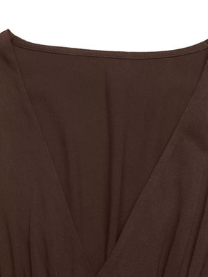Brown V-neck midi dress with a-line cut and puff sleeves, showing neckline detail.