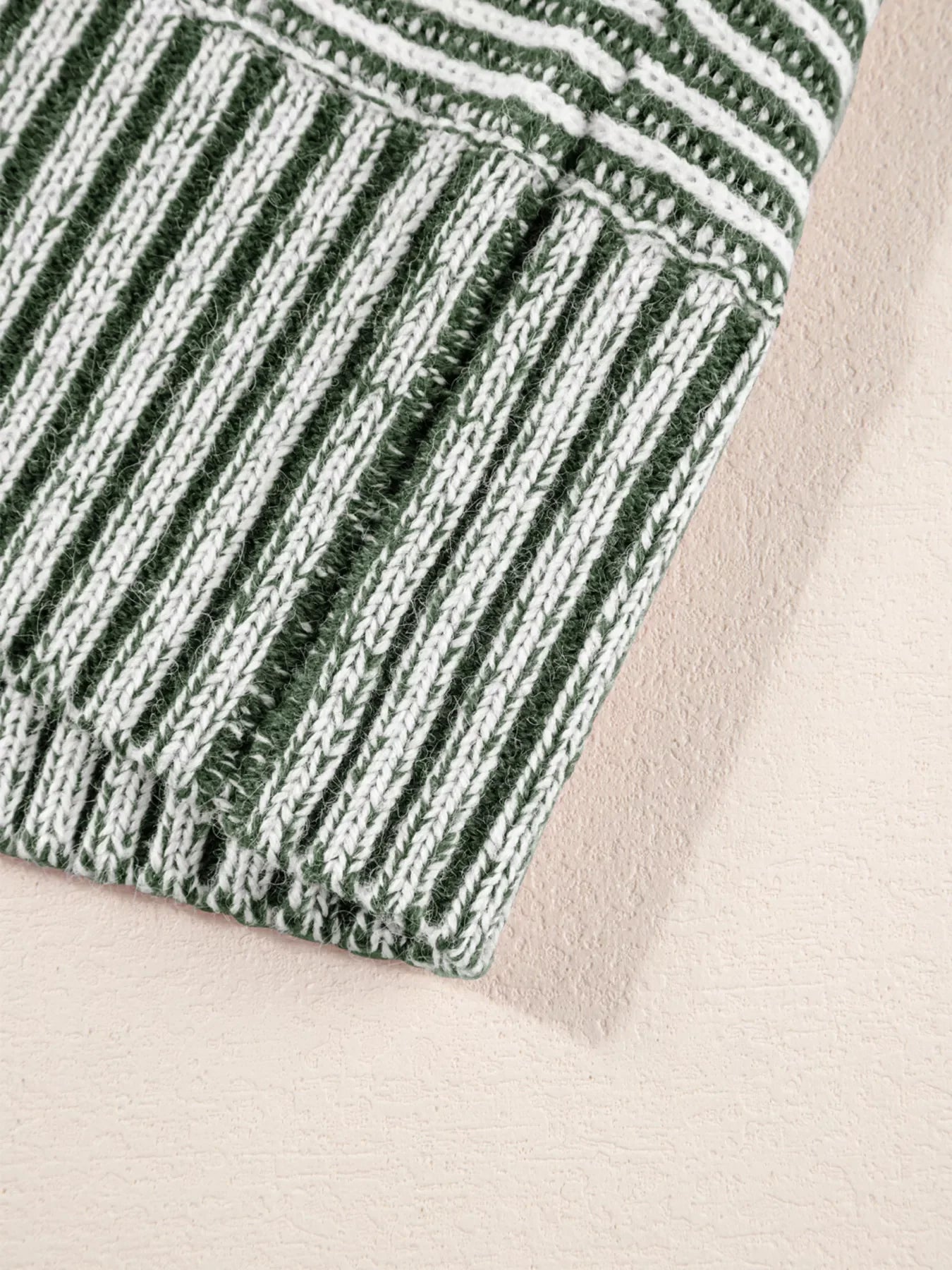 Relaxed ribbed knit sweater with green and white stripes, boat neck detail