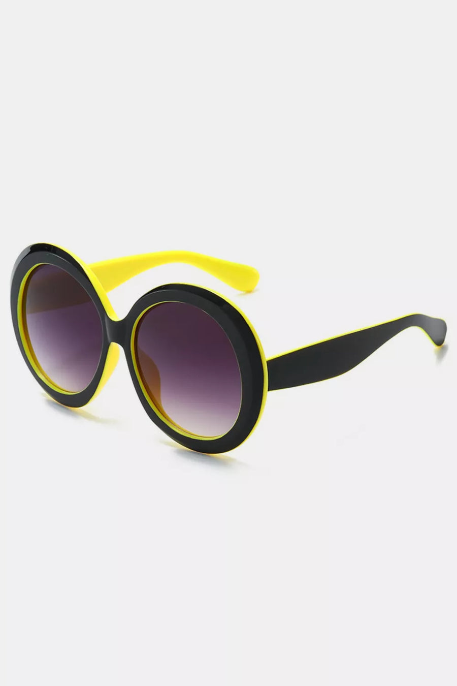Chic oversized round sunglasses with black frames and yellow accents.