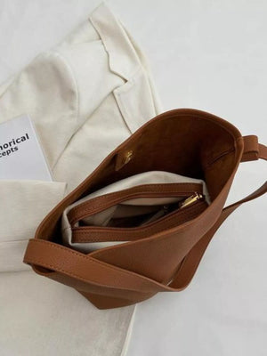 Brown minimalist PU leather shoulder bag with interior zippered pockets