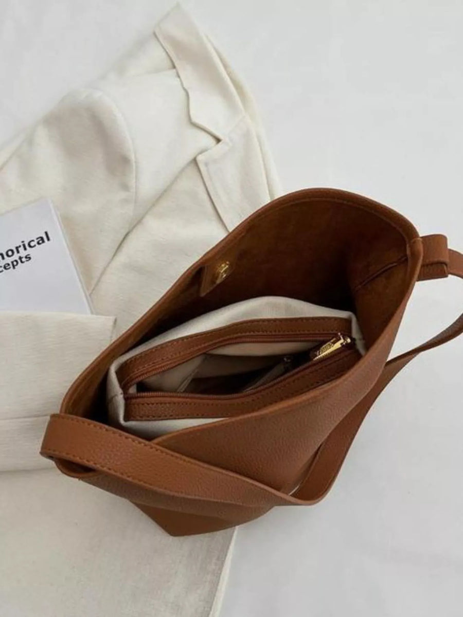 Brown minimalist PU leather shoulder bag with interior zippered pockets
