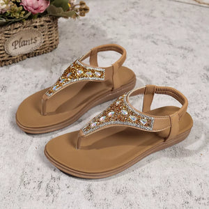 Brown rhinestone-embellished toe post sandals with elastic ankle straps.