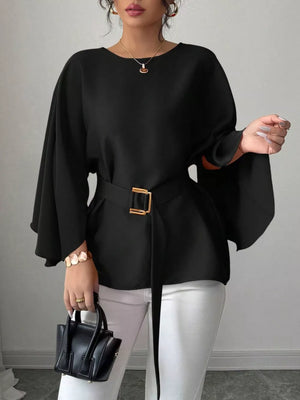 Black belted blouse with batwing sleeves and gold buckle detail.