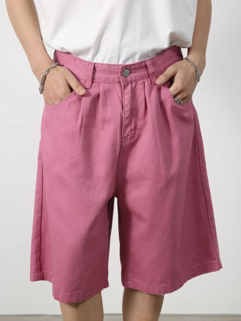 Pleated Bermuda shorts in Moonlit Mauve with a buttoned waist and wide leg.