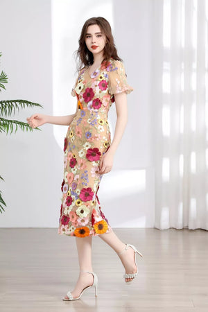 Sheer floral embroidered midi dress with V-neck and short sleeves in tan.