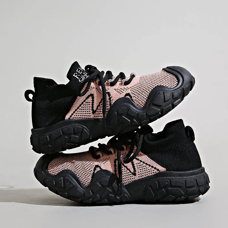 Sculpted knit athleisure sneakers in dusty pink and black with chunky soles.