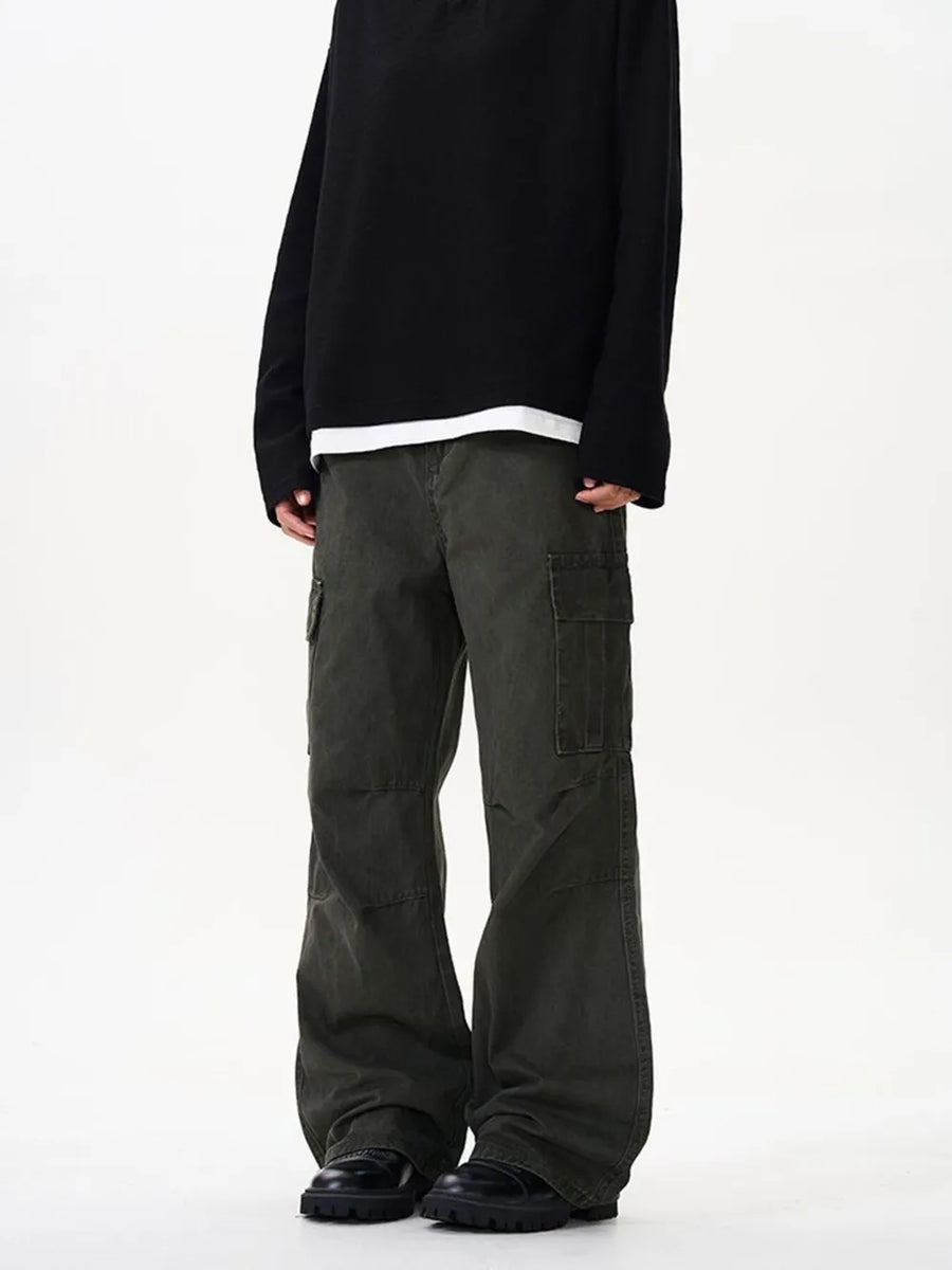 Tailored cargo pants in military green with versatile pockets and a relaxed fit.