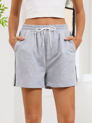 Heathered gray jogger shorts with drawstring and sporty side trim.