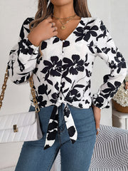 White floral knot-front blouse with ruffled cuffs and button detail
