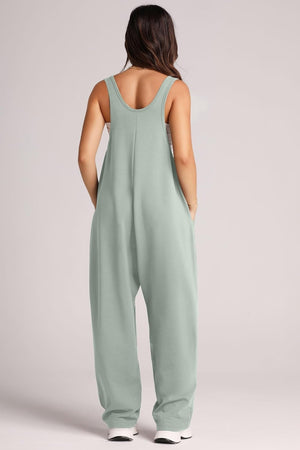 Relaxed fit jumpsuit in Matcha Green with oversized pockets and scoop neckline.