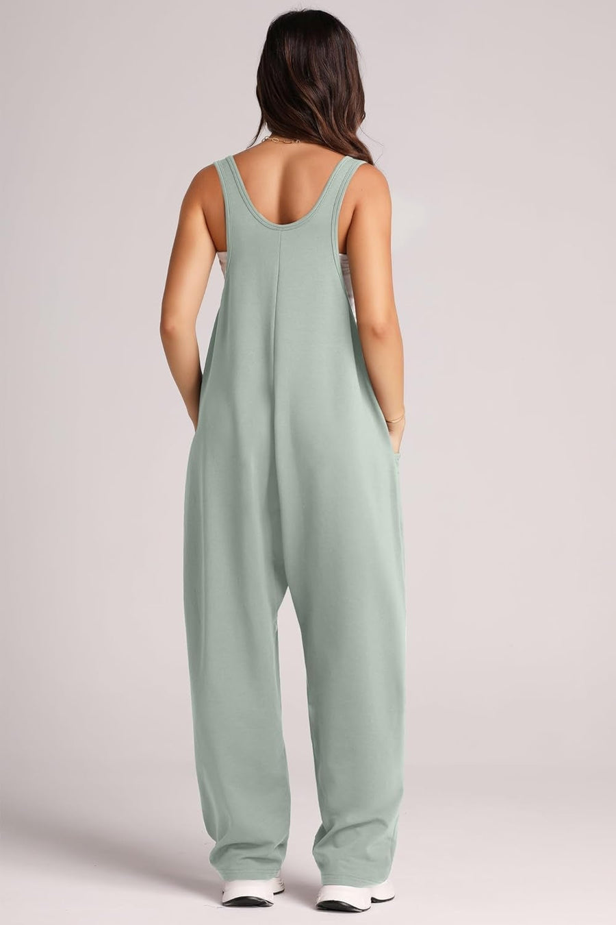 Relaxed fit jumpsuit in Matcha Green with oversized pockets and scoop neckline.