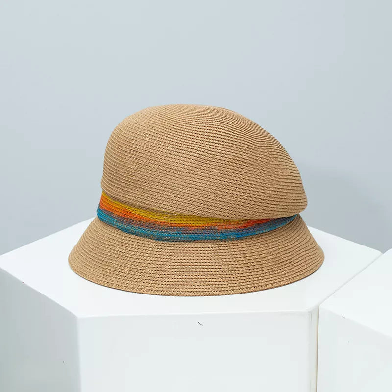 Chic straw cloche hat in Khaki with a vibrant rainbow band.