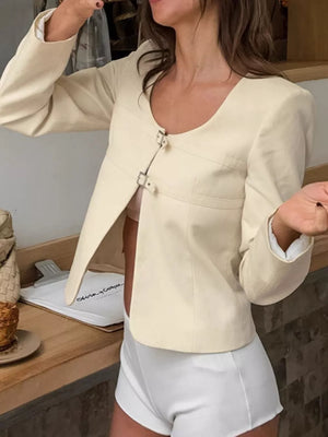 100% polyester Care instructions: Machine wash cold jacket in ivory with fitted silhouette