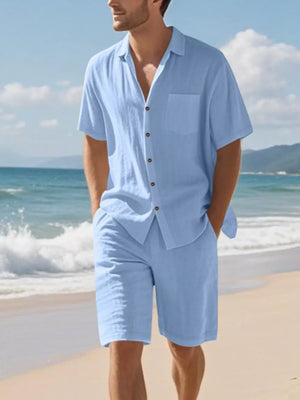 Men's light blue short sleeve button-up shirt and shorts set with a chest pocket.