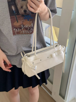 Chic white PU leather shoulder bag with bow detail and heart charm