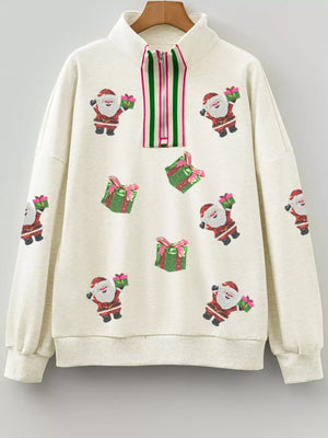 Light gray zip neck sweatshirt with allover sequin Santa and gift pattern.