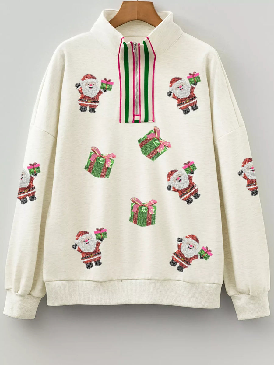 Light gray zip neck sweatshirt with allover sequin Santa and gift pattern.