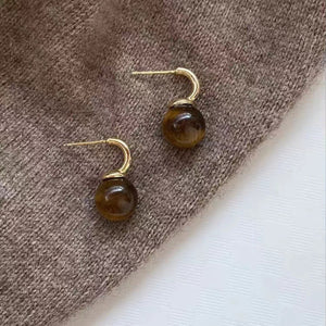 earrings in Gold with natural stone pattern and ball drop