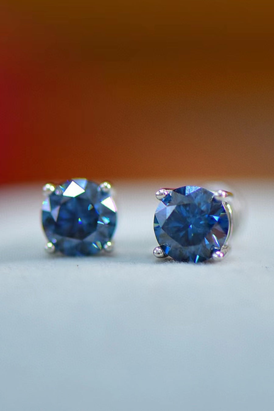 Sapphire Brilliance Platinum Stud Earrings with bright blue stones.