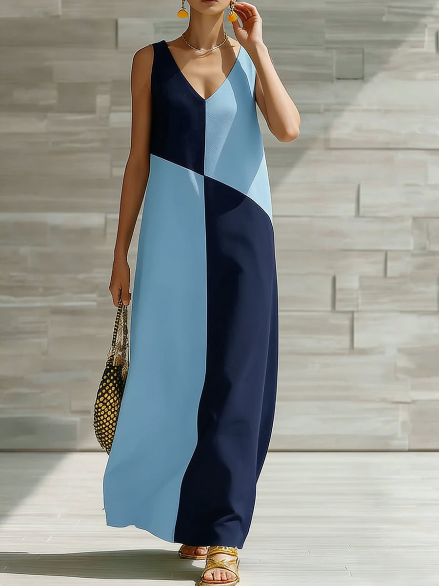 Geometric V-neck maxi dress in light blue and navy with a colorblock pattern.
