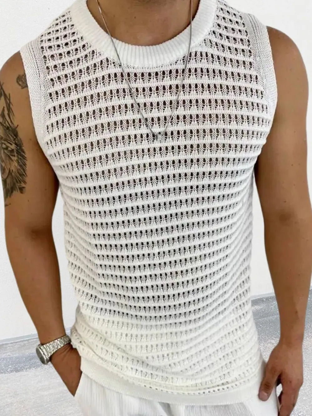 Openwork knit tank top in ivory with a crew neckline and sleeveless design.