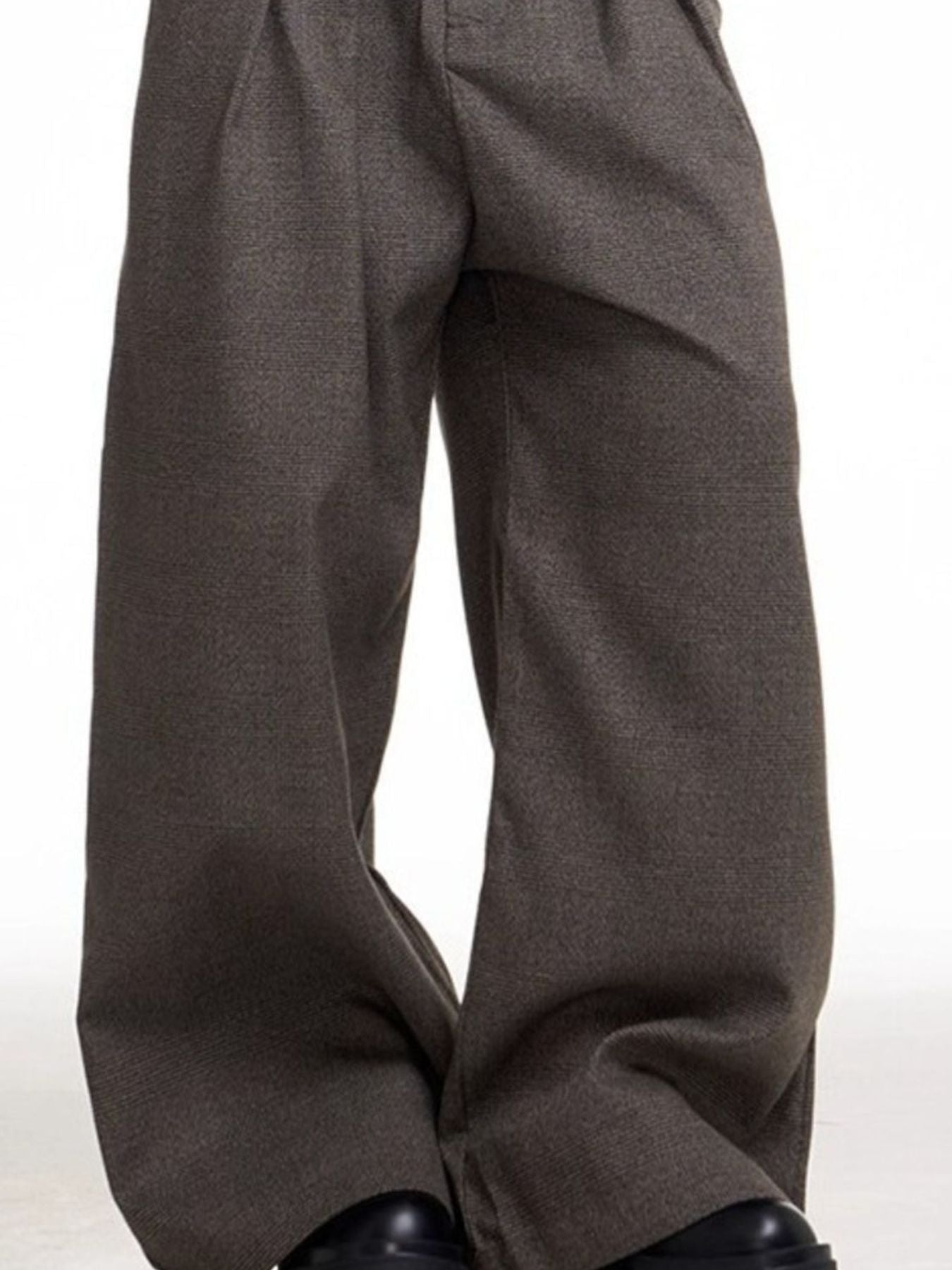 Plus size brown wide leg sweatpants with a high waist and relaxed fit.