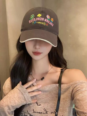 Brown cotton baseball hat with floral embroidery and white trim