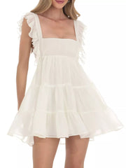 Ivory white ruffled square neck mini dress with tiered skirt and flutter sleeves.