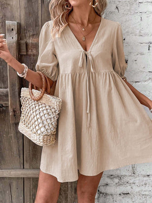 Khaki tie front puff sleeve mini dress with a-line cut and v-neckline