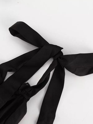 Black camisole with tie straps and lace trim detail