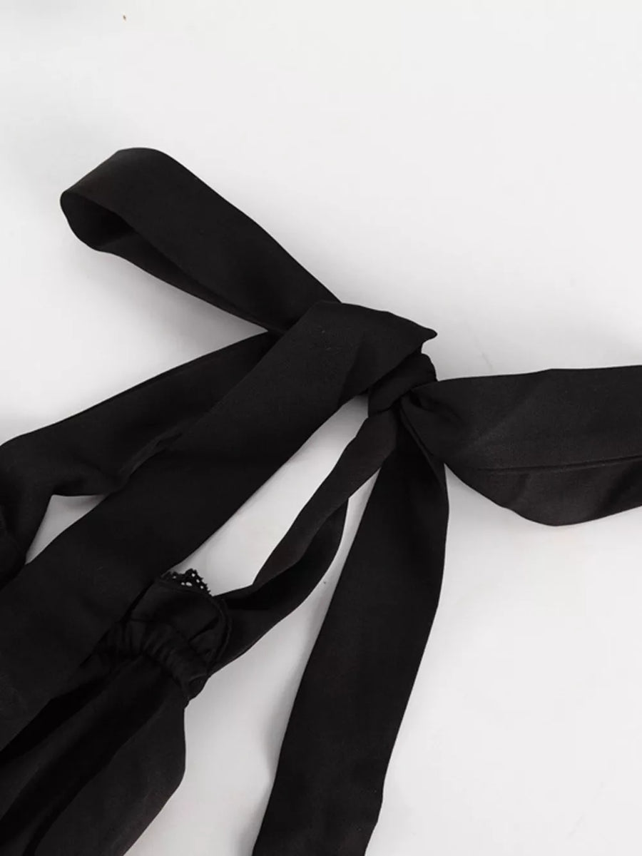 Black camisole with tie straps and lace trim detail